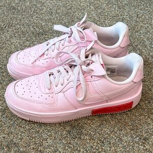 Nike Pink Low-Top Sneakers with Red Midsole Accent